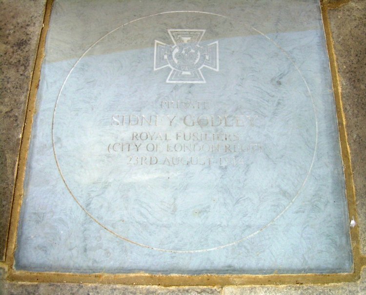 The flagstone set into the foot of East Grinstead's war memorial honouring Godley's bravery and his commitment to his duty and to his comrades.
