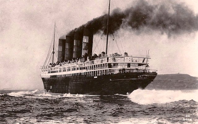 RMS Lusitania under full steam in her pre-war livery.