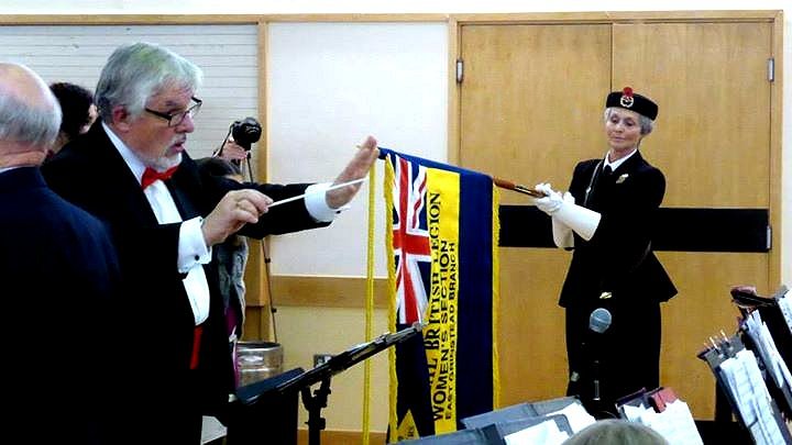 Lowering the standard during the playing of "SUNSET" during last year's Poppy Appeal Concert in East Grinstead.